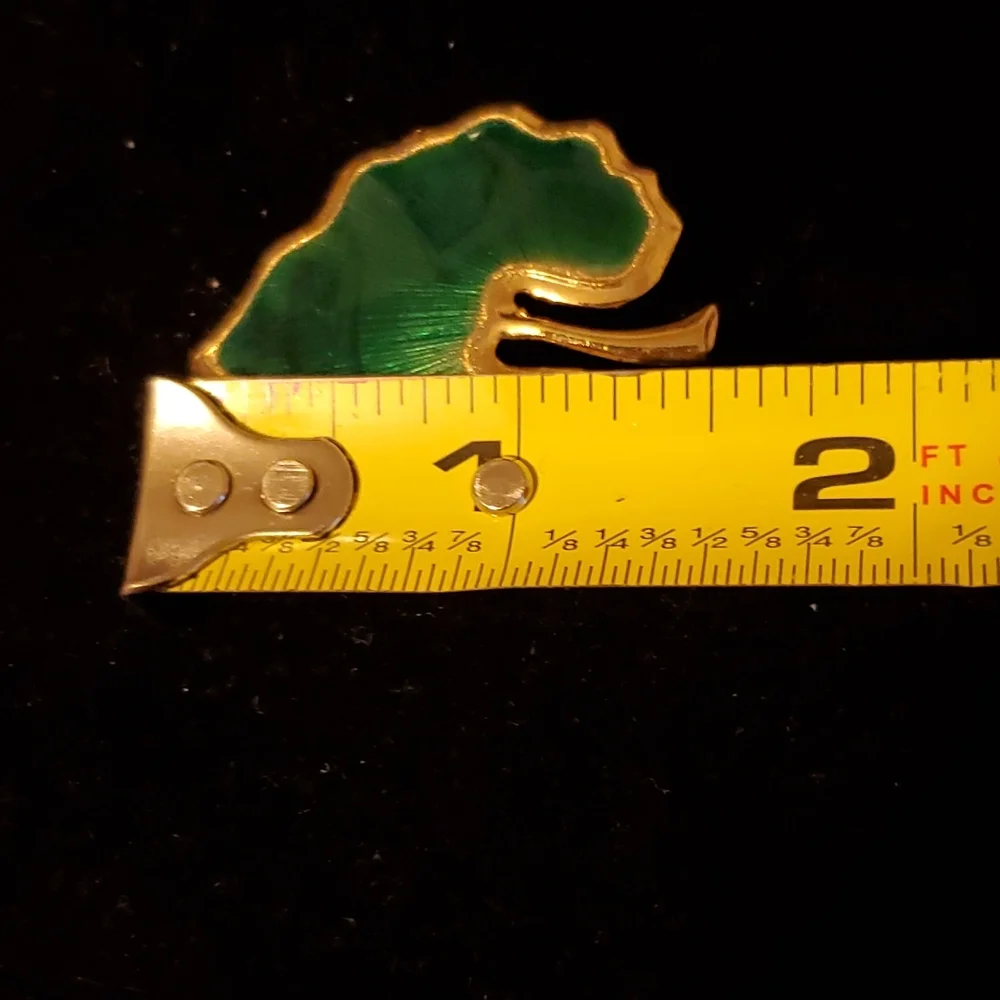 Goldtone and green enamel leaf brooch